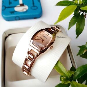 Fossil Women's Rose Gold Analog Mini Bracelet Watch 
Stainless Steel